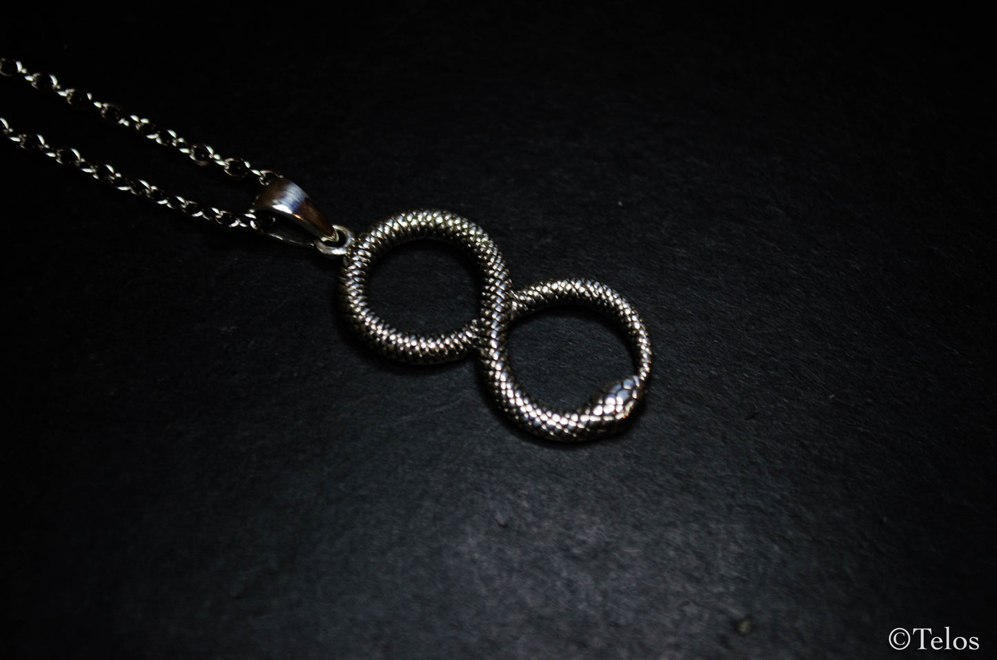 Sterling silver infinity snake pendant