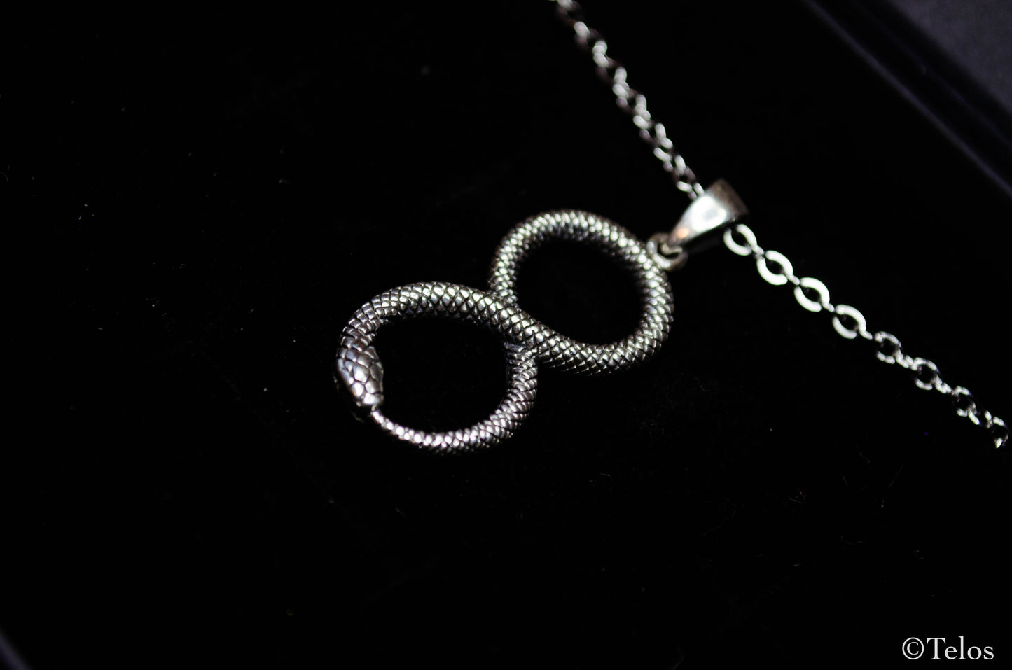 Sterling silver infinity snake pendant